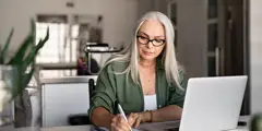 Social Worker At Home On Laptop Gettyimages 1161412603