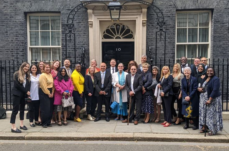 The Fostering Network team and foster carers gather outside 10 Downing Street 